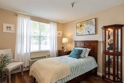 Cozy resident room with a bed and natural light