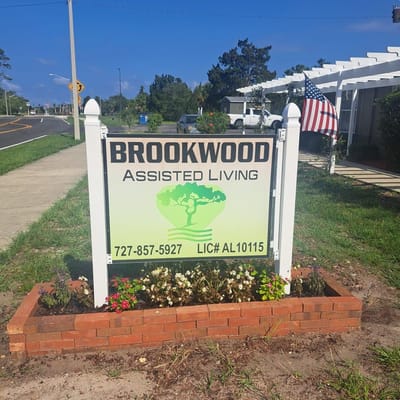 Sign for Brookwood Assisted Living facility with landscaping