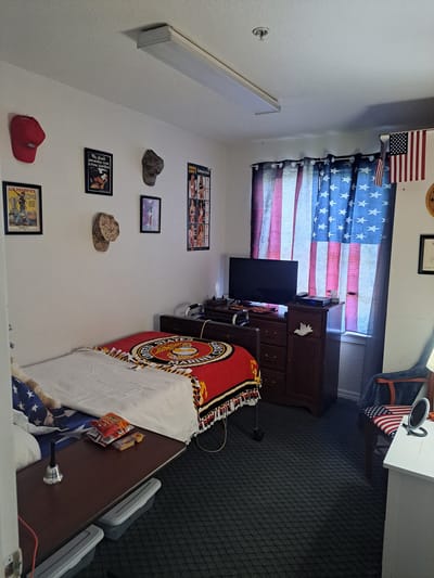 Cozy resident room with patriotic decor and personal items