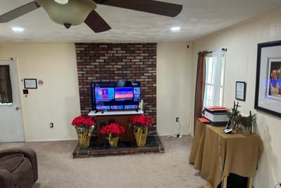 Cozy common area with seasonal decorations and a TV