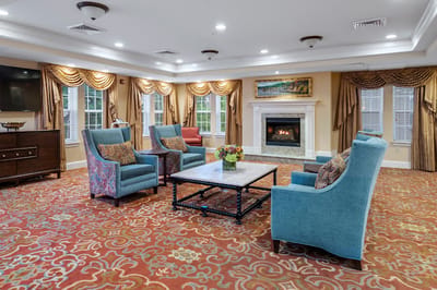 Cozy common area with comfortable seating and a fireplace