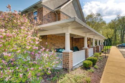 Exterior view of the facility with blooming flowers