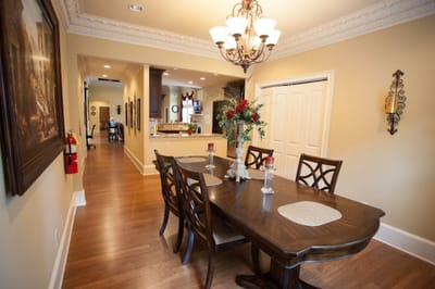 Bright dining room with wooden table and floral decor