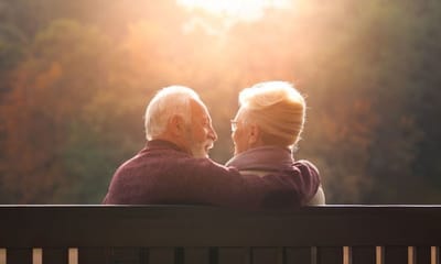 Older couple enjoying each other's company outdoors