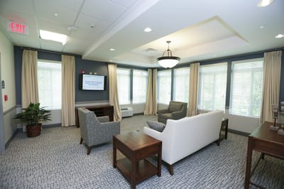 Bright common area with seating and windows