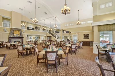 Elegant dining room with tables and chairs in a senior living facility