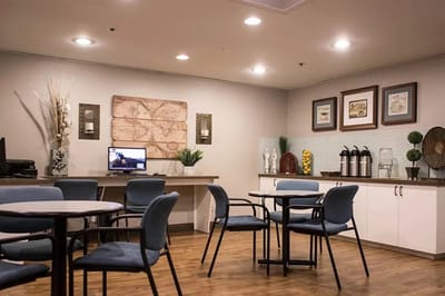 Interior view of a common area with tables and chairs