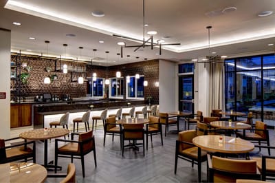 Modern dining area with tables and seating