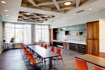 Bright and modern common area with dining setup