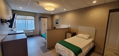 Interior view of a resident room with two beds