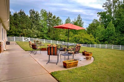 Outdoor seating area with tables and umbrellas