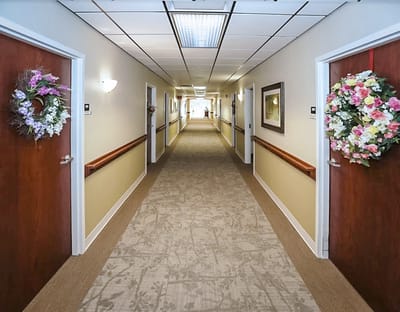Interior hallway decorated with floral arrangements
