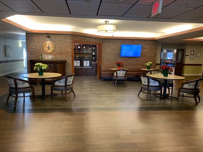 Interior view of a common area with tables and seating