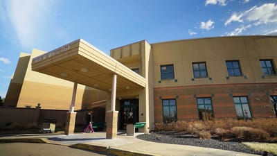 Front entrance of the facility with residents