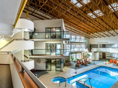 Interior view of a bright atrium pool area