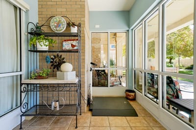 Bright entrance area with plants and decor