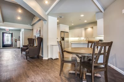 Bright common area with seating and dining space