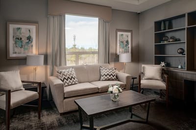 A cozy common area with comfortable seating and decor