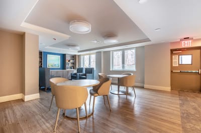 Interior common area with seating and bookshelves