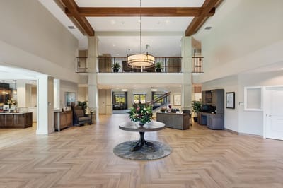Spacious lobby area with plants and seating