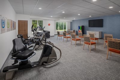 Exercise area equipped with fitness machines and seating