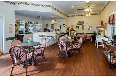 Cozy dining area with tables and chairs