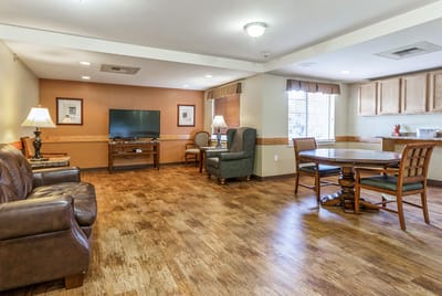 Bright common area with seating and dining space