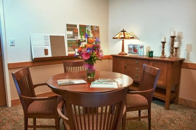 Bright interior room with a table and flowers