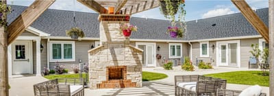 Outdoor seating area with a fireplace and planters
