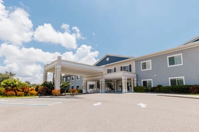 Exterior view of the facility building with landscaping