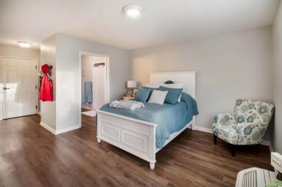 Bright, spacious resident bedroom with modern decor
