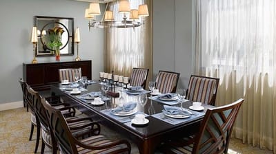 Elegant dining room with a long table set for a meal