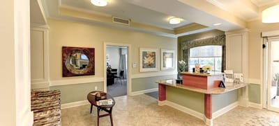 Bright reception area with seating and artwork
