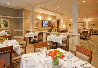 Elegant dining room setup with flowers on the tables