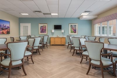 Bright dining area with tables and chairs