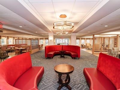 Interior common area with red seating and tables
