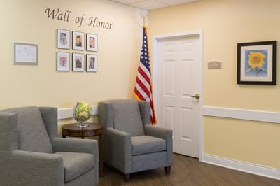 Common area with chairs and Wall of Honor