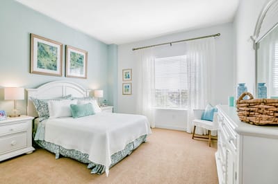 Bright, well-decorated resident room with a bed