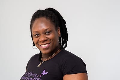 Smiling staff member in a casual setting