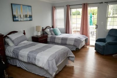 Bright interior of a resident room with twin beds