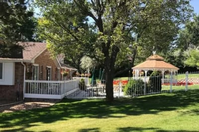 A peaceful outdoor area with a gazebo and gardens
