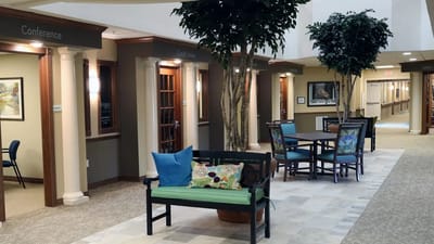 Interior common area with seating and decorative trees