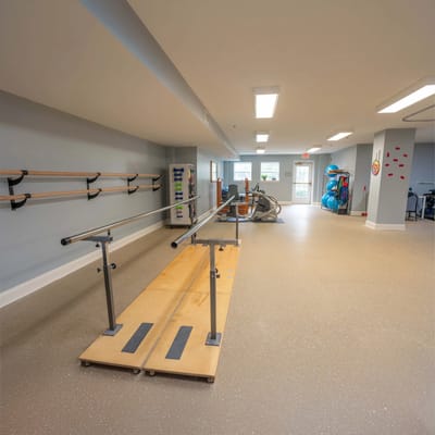 Rehabilitation area with equipment and bars for therapy