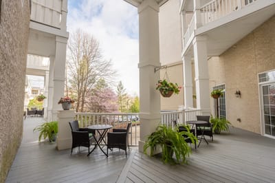 Outdoor seating area with potted plants
