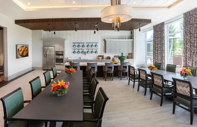 Bright dining area with flower centerpieces and modern decor