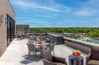 Outdoor dining area with tables and flowers