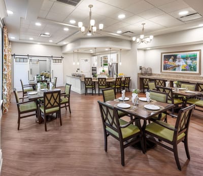 Bright dining room setup with tables and chairs
