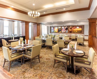 Elegant dining area with tables and chairs