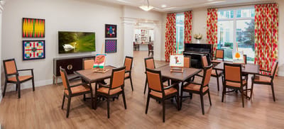 Interior view of a common area with tables and decor