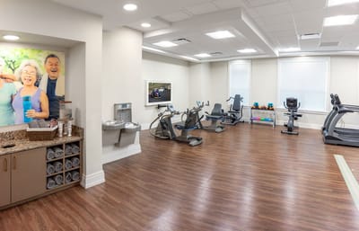 Fitness area with residents engaging in activities